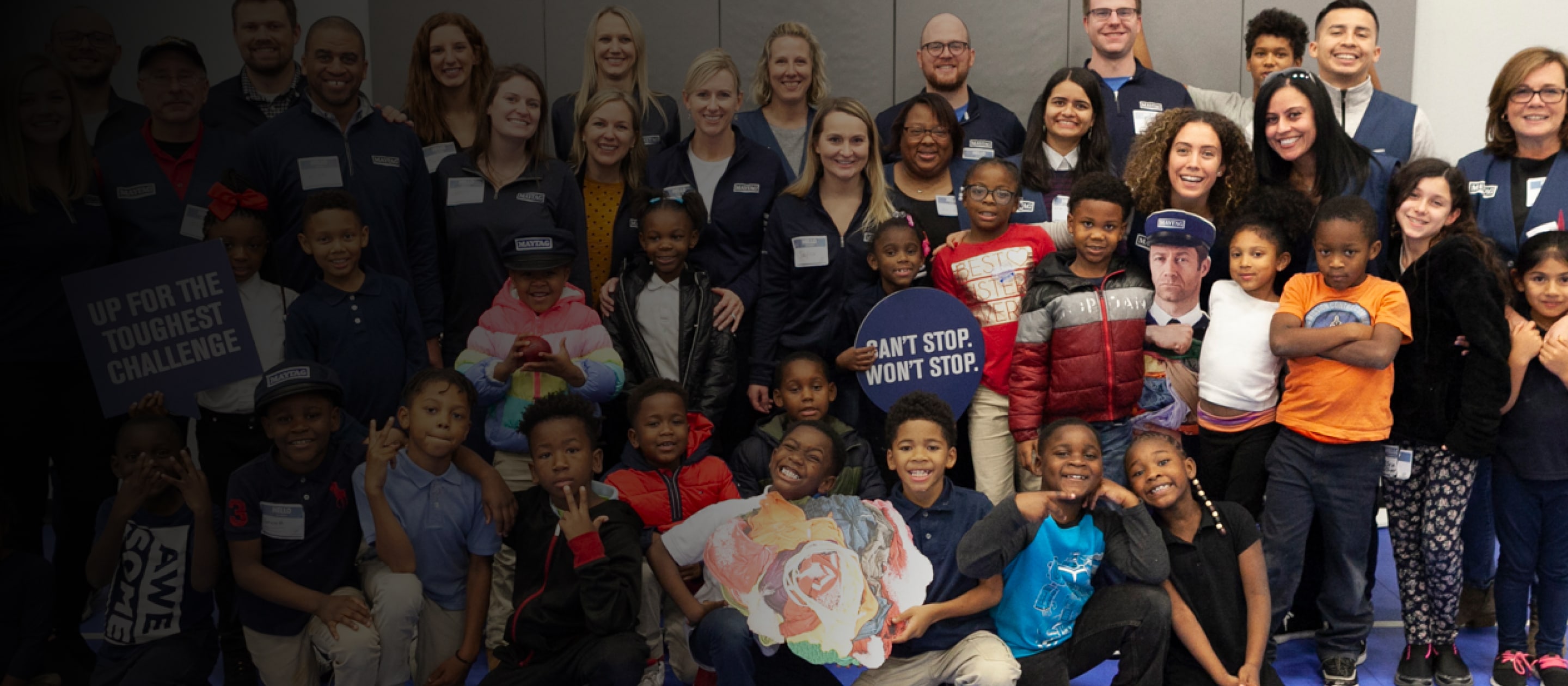 Group photo of the Maytag team with many BGCA members