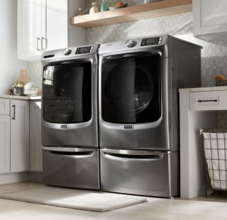A Maytag® washer and dryer in a laundry room