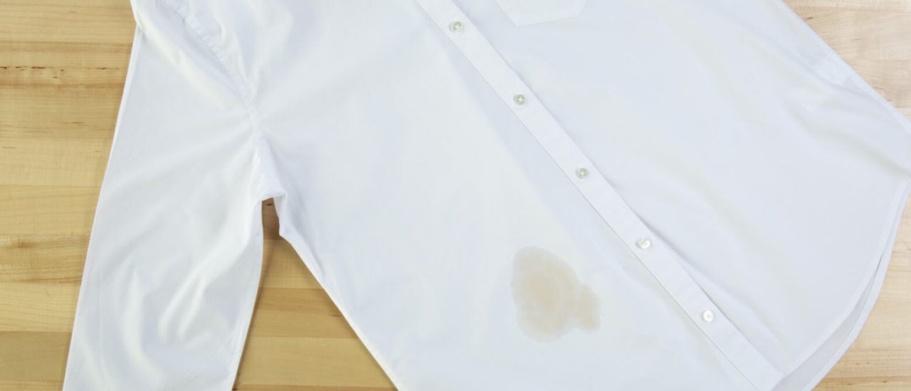 A white shirt with a coffee stain A white shirt with a coffee stain