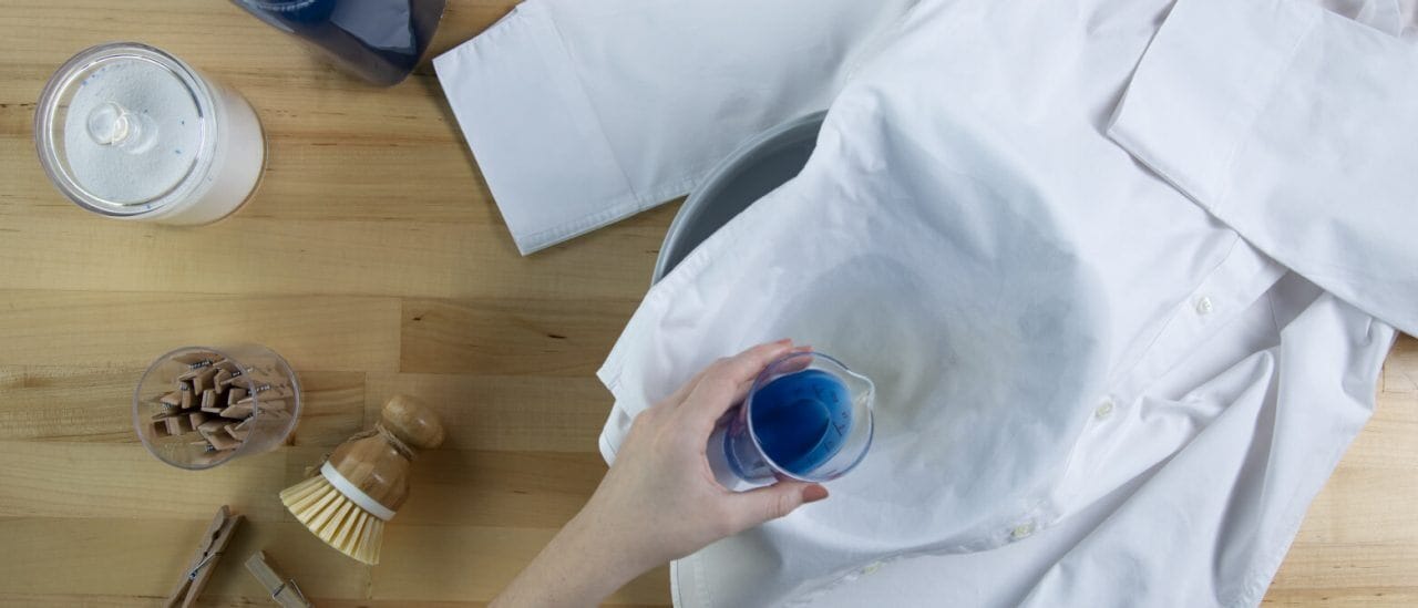 Treating a coffee stain on a white shirt with detergent Treating a coffee stain on a white shirt with detergent