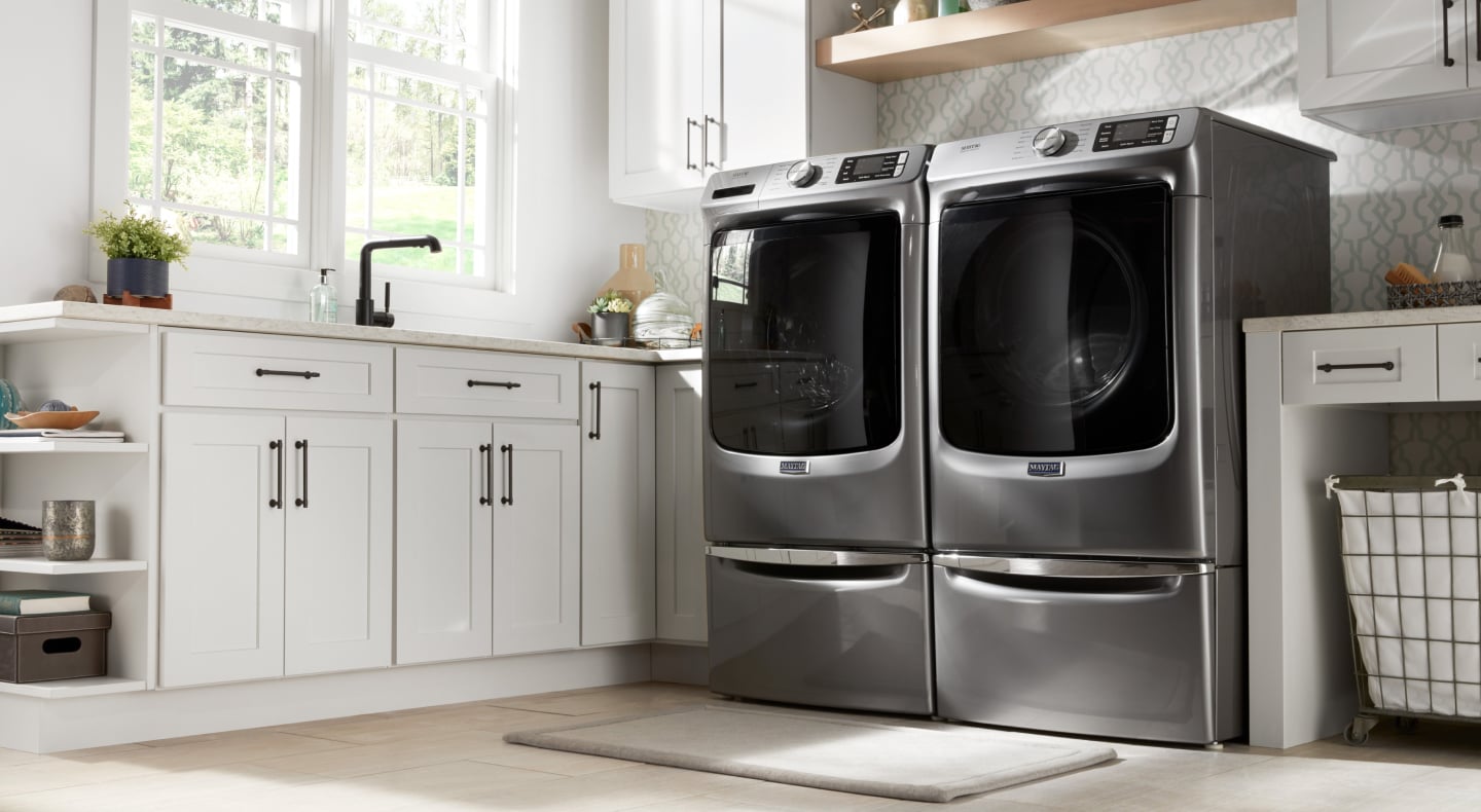 Maytag® washer and dryer set in a laundry room Maytag® washer and dryer set in a laundry room