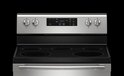 A Maytag® electric stove on a black background