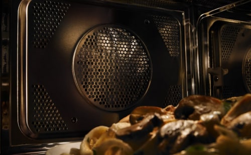 Plate of mushrooms inside a microwave