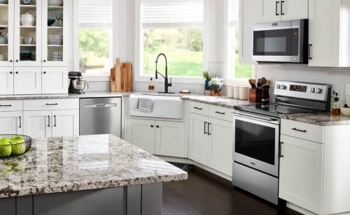 Maytag® appliances in a kitchen with white cabinets