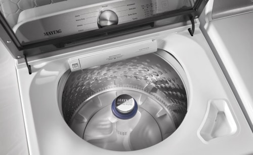 A close-up of the interior of a Maytag® top load washer