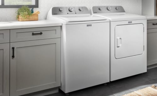 White top load washer and matching dryer