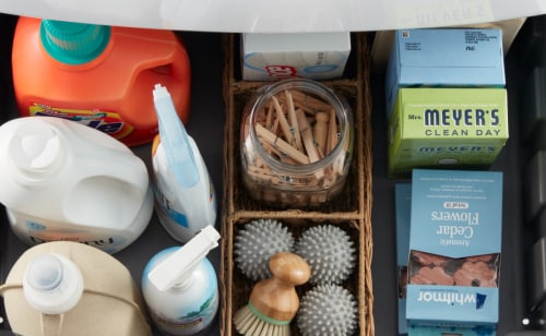 Laundry supplies in baskets and jars