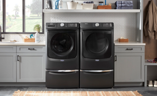 Maytag® front load washer and dryer side-by-side in a laundry room